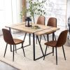 A set of 4 modern medieval style restaurant cushioned side chairs, equipped with soft cushions and black metal legs, suitable for kitchens, lounges